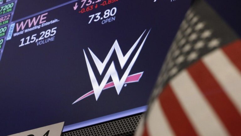 The World Wrestling Entertainment (WWE) logo appears above a trading post on the floor of the New York Stock Exchange, Sept. 13, 2019. (AP Photo/Richard Drew)