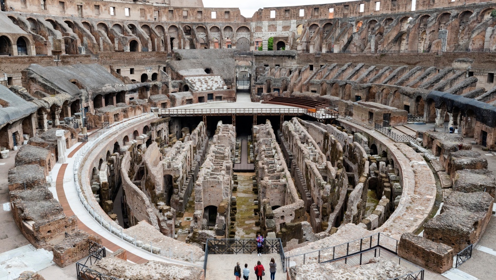 In this April 26, 2021 file photo, few visitors arrive for their tour of the ancient Colosseum, in Rome. (AP Photo/Domenico Stinellis, file)