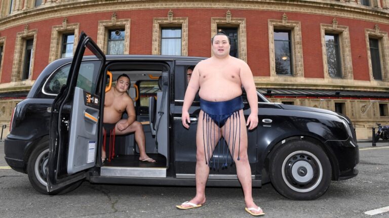 Rishikis from Japan's Sumo Kyokai, Daisuke Kitanowaka, right, and Akira Fukutsuumi pose for a photo call outside of London's Royal Albert Hall in London, Wednesday, Dec. 4, 2024. (Thomas Krych / AP Photo)