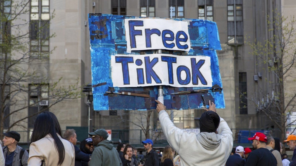 A man carries a Free TikTok sign in front of the courthouse where the hush-money trial of Donald Trump was underway on April 15, 2024, in New York. (AP Photo/Ted Shaffrey, File)
