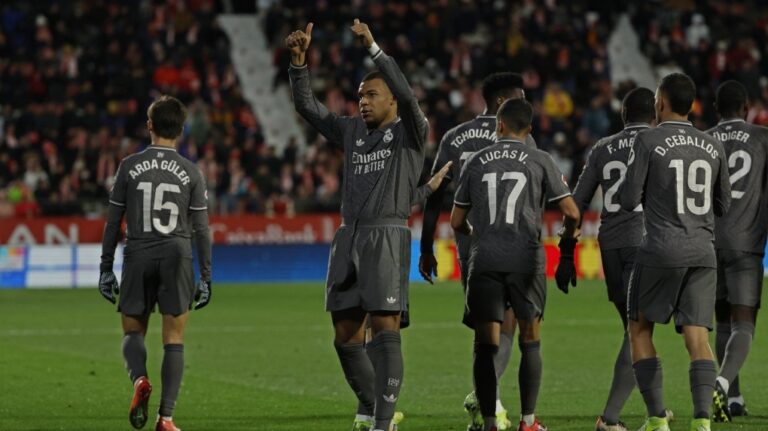 Real Madrid's Kylian Mbappe celebrates after scoring his side's third goal in Girona, Spain, Saturday, Dec. 7, 2024. (AP Photo/Joan Monfort)