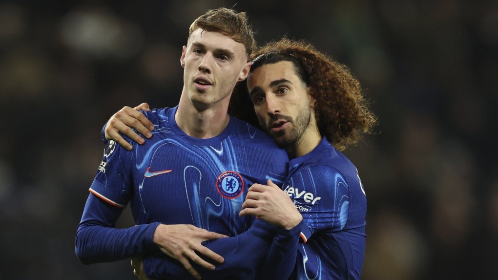Chelsea's Cole Palmer celebrates with his teammate Marc Cucurella in London, Sunday, Dec.8, 2024. (AP Photo/Ian Walton)