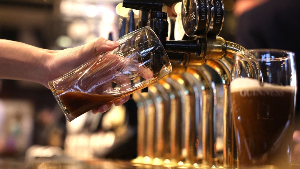 A pint of Guinness is poured at a pub in central London in November 2023. (Daniel Leal/AFP/Getty Images via CNN Newsource)