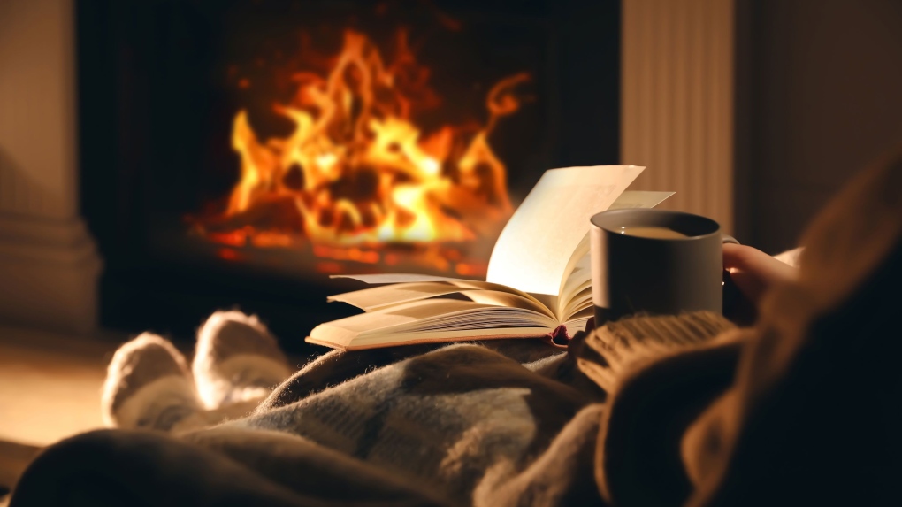 Cozying up with a treat and embracing alone time can be nourishing during the holidays. (Liudmila Chernetska/iStockphoto/Getty Images via CNN Newsource)