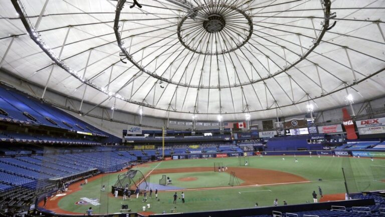 Members of the Tampa Bay Rays take batting practice at Tropicana Field before a baseball game against the Toronto Blue Jays, July 24, 2020, in St. Petersburg, Fla.. (AP Photo/Chris O'Meara, File)