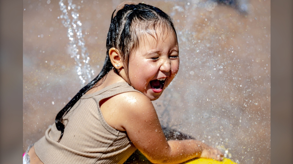 Emma Vaquera, 3, of Pomona, plays in the splash pad at Monte Vista Park in Chino, Calif. on Aug. 30, 2022. (Watchara Phomicinda / The Orange County Register via AP)