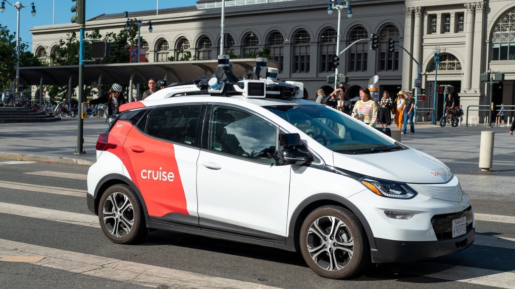 A General Motors Cruise self-driving car, often referred to as a robotaxi, drives in front of the Ferry Building on the Embarcedero, San Francisco in 2023. (Smith Collection/Gado/Getty Images via CNN Newsource)