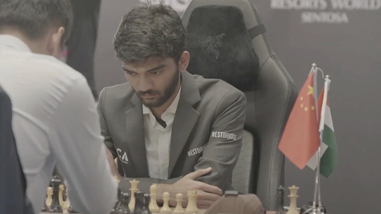 Gukesh Dommaraju takes part in Game 13 of the World Chess Championship against defending champion Ding Liren on Dec. 11, 2024.