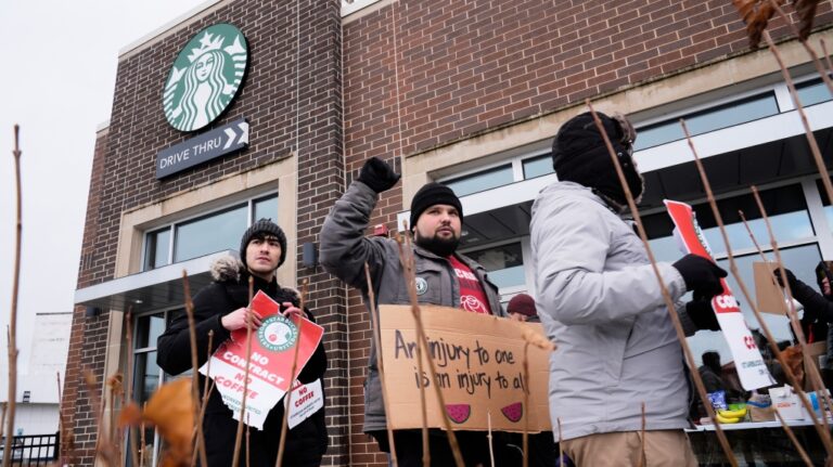 Employees picket outside a Starbucks store, Dec 20, 2024, in Chicago. (AP Photo/Kiichiro Sato)