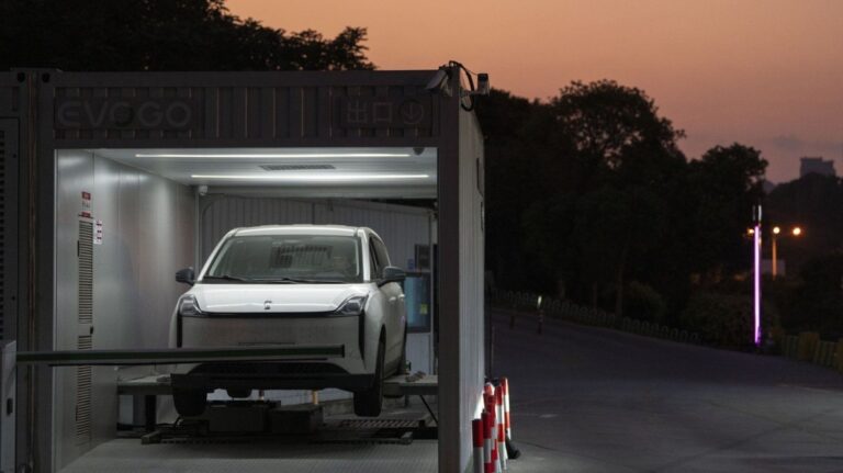 A driver gets his car battery swapped at a first generation station by China-based CATL battery manufacturing company, in Xiamen, Fujian province, China, Wednesday, Dec. 18, 2024. (AP Photo/Ng Han Guan)
