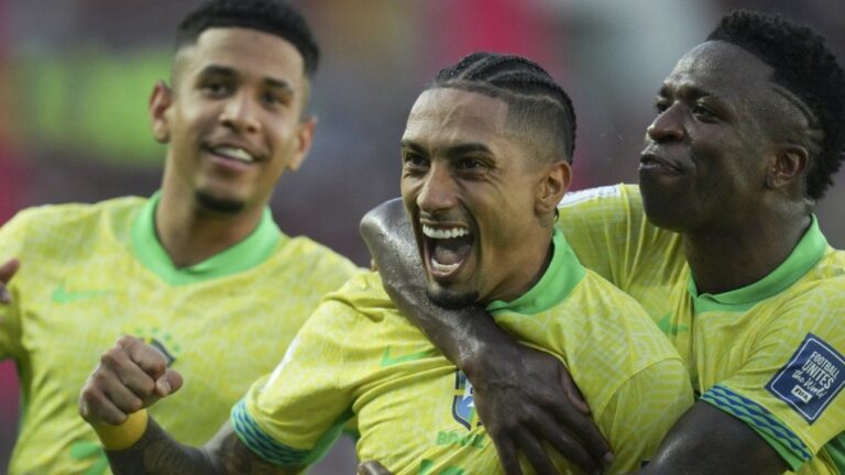 Brazil's Raphinha celebrates with Vinicius Junior after scoring against Venezuela during a FIFA World Cup 2026 qualifying match in Maturin, Venezuela in November 2024. (AP Photo/Ariana Cubillos)
