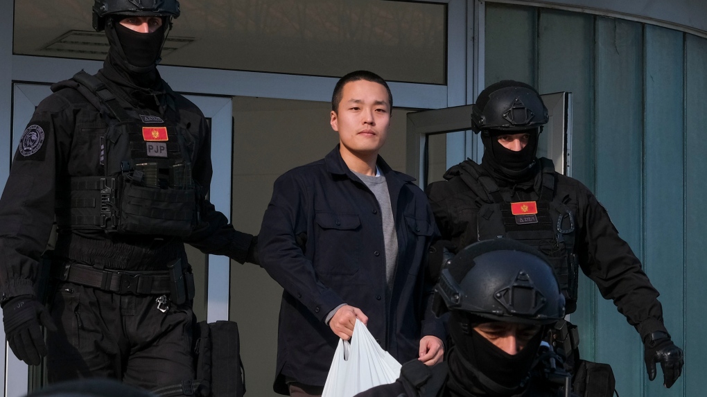 Montenegrin police officers escort Terraform Labs founder Do Kwon in Montenegro's capital Podgorica, March 23, 2024. (AP Photo/Risto Bozovic, File)