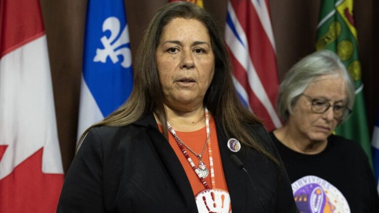 Survivor of the Mohawk Institute and board member of The Survivors’ Secretariat Roberta Hill, right, looks on as Secretariat Executive Lead Laura Arndt speaks during a news conference on Parliament Hill, in Ottawa, Monday, Sept. 30, 2024. (Adrian Wyld/The Canadian Press)