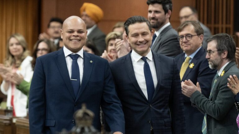 Leader of the Conservative Party Pierre Poilievre walks with new Member of Parliament for Durham Jamil Jivani as he takes his place in the House of Commons before Question Period, Monday, April 8, 2024 in Ottawa. THE CANADIAN PRESS/Adrian Wyld