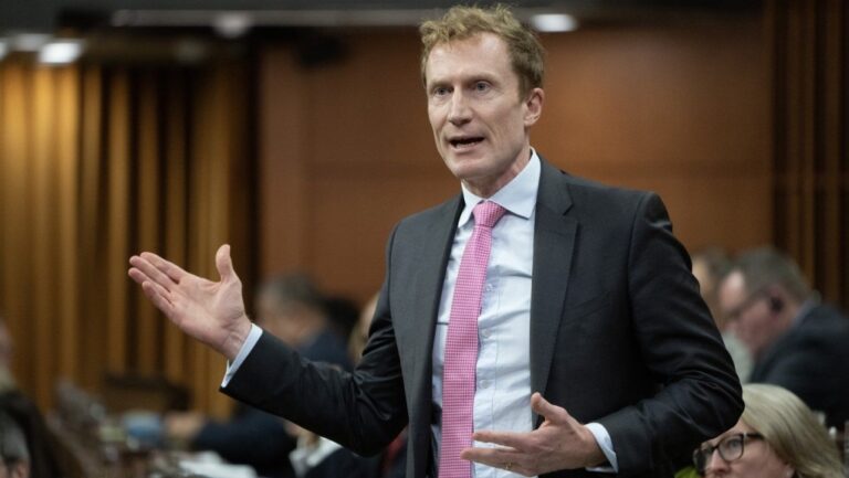 Immigration, Refugees and Citizenship Minister Marc Miller rises during Question Period, Monday, Dec 2, 2024 in Ottawa. THE CANADIAN PRESS/Adrian Wyld