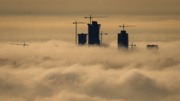 Condo towers under construction and cranes at the Oakridge Mall redevelopment are shrouded in fog, in Vancouver, B.C., Dec. 3, 2024. THE CANADIAN PRESS/Darryl Dyck