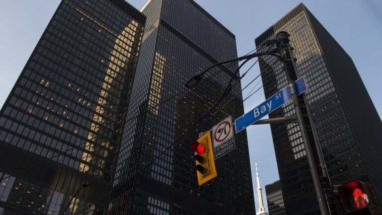 A street light on Bay Street in Canada's financial district is shown in Toronto on Wednesday, March 18, 2020. THE CANADIAN PRESS/Nathan Denette