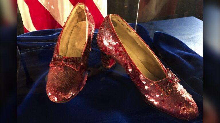 Ruby slippers once worn by Judy Garland in the "The Wizard of Oz," are displayed at a news conference, Sept. 4, 2018, at the FBI office in Brooklyn Center, Minn. (AP Photo/Jeff Baenen)