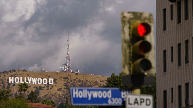 In this Saturday, Nov. 7, 2020, photo clouds move over the Hollywood sign in Los Angeles. (AP Photo/Damian Dovarganes)