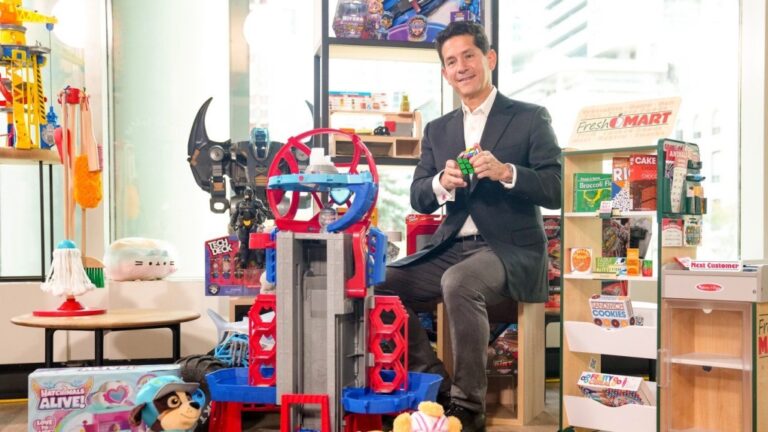 Spin Master CEO Max Rangel poses with toys after a press conference in Toronto on October 11, 2023. THE CANADIAN PRESS/Chris Young
