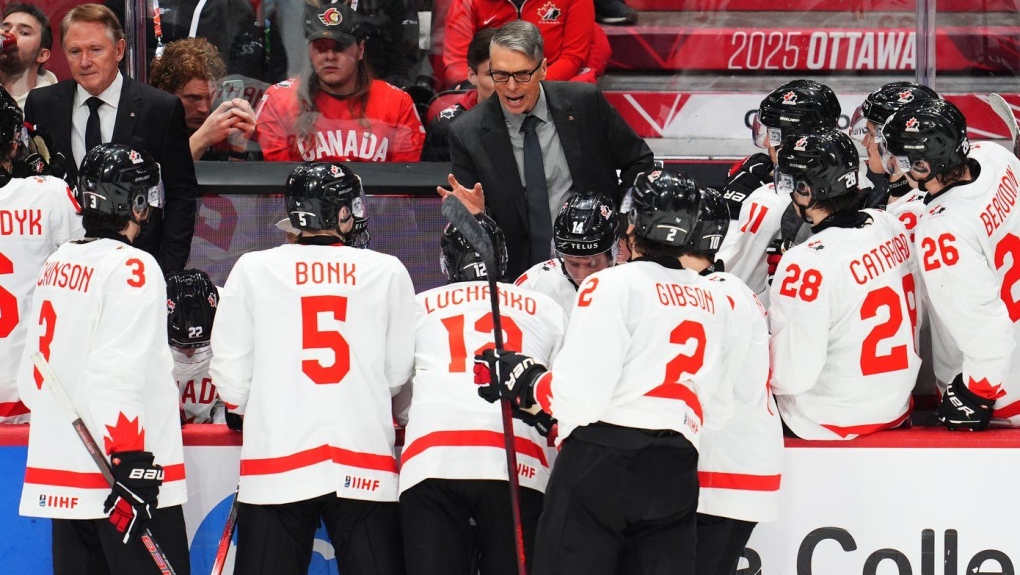 Canada head coach Dave Cameron speaks to his players during third period IIHF World Junior Hockey Championship preliminary round action against Latvia in Ottawa on Friday, Dec. 27, 2024. THE CANADIAN PRESS/Sean Kilpatrick