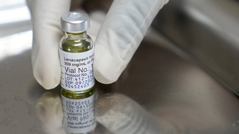 A pharmacist holds a vial of lenacapavir, the new HIV prevention injectable drug, at the Desmond Tutu Health Foundation's Masiphumelele Research Site, in Cape Town, South Africa, Tuesday, July 23, 2024. (AP Photo/Nardus Engelbrecht, File)