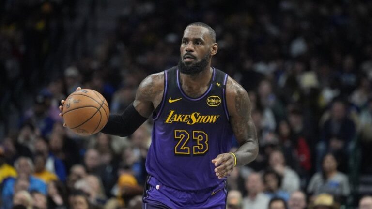 Los Angeles Lakers forward LeBron James dribbles during the second half of an NBA basketball game against the Dallas Mavericks, Tuesday, Jan. 7, 2025, in Dallas. (AP Photo/LM Otero)