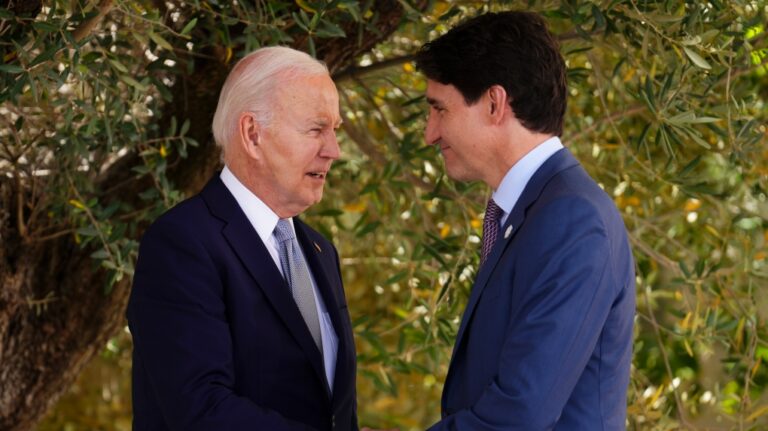 Canadian Prime Minister Justin Trudeau talks with U.S. President Joe Biden as they take part in a family photo at the G7 Summit in Savelletri Di Fasano, Italy on Thursday, June 13, 2024. (Sean Kilpatrick / The Canadian Press)