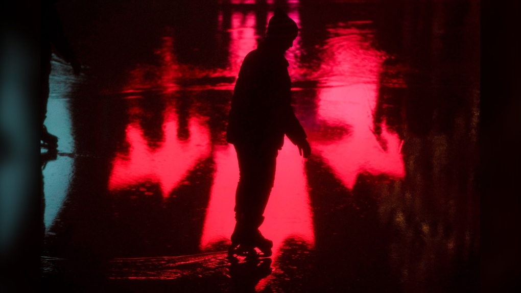 People skate in the rain during the New Year's Eve celebrations held at Nathan Phillips Square in Toronto in 2018. (THE CANADIAN PRESS/Tijana Martin)
