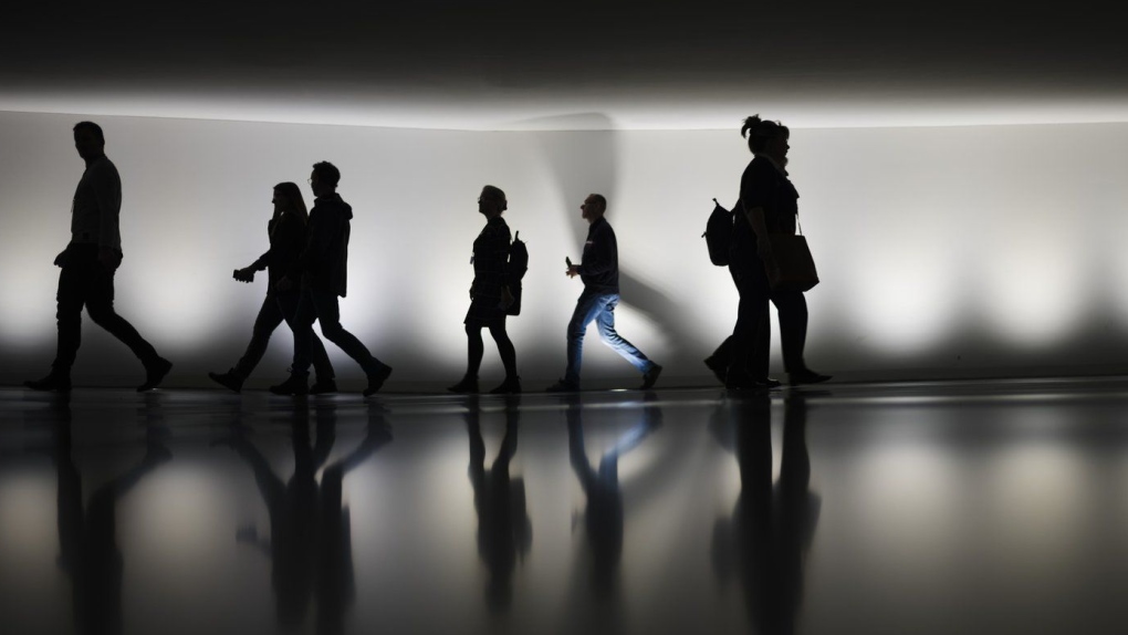 People walk through a tunnel in Berlin, Germany, Wednesday, Nov. 22, 2023.  THE CANADIAN PRESS/AP/Markus Schreiber